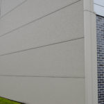 Insulated steel panels with a stucco finish capping off the sides of the Westwood apartments for additional insulation
